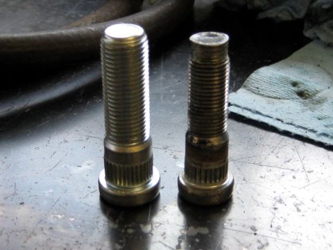 1996 Ford Bronco - Comparison of a new wheel stud next to a used and worn one.