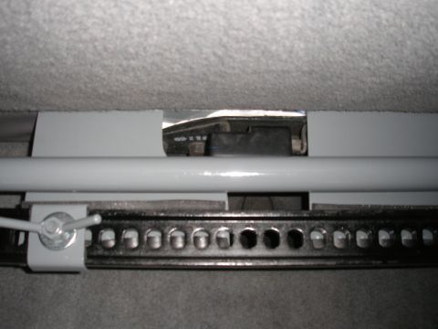 1995 Ford Bronco - A hi-lift jack mount is visible, secured beneath the vehicle's seat upholstery.