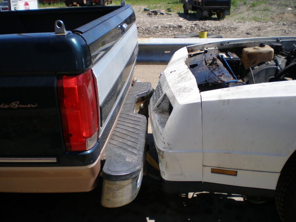 Dark green and silver pickup truck rear bumper and tailgate. 1995 Ford F-150