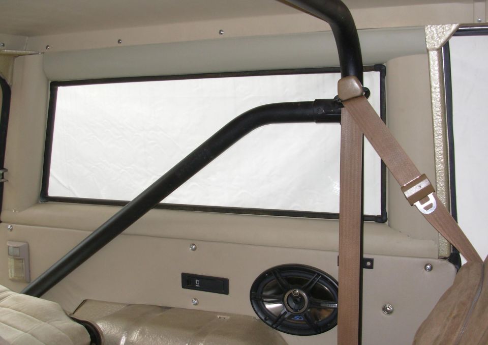 Interior roll cage bar and rear side window of a Bronco