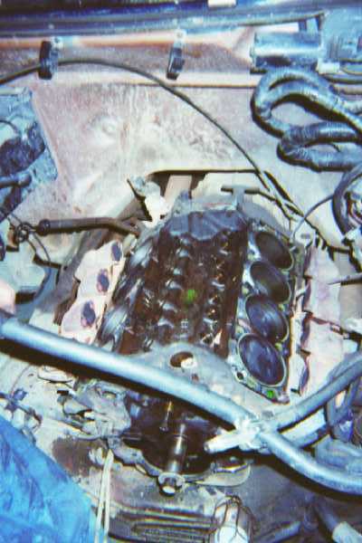 1988 Ford Bronco - One broken short block, ready to come out. It was about this time we realized the back two cylinders wouldn't move when we turned the crank.
