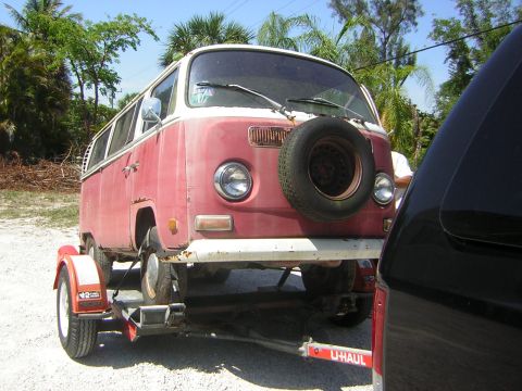 1971 Volkswagen Vanagon - A red and white 1971 Volkswagen Vanagon is seen being towed on a U-Haul trailer.