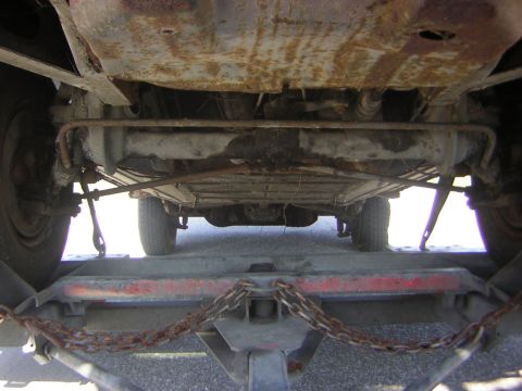 1971 Volkswagen Vanagon - Vehicle chassis and undercarriage details visible from below while on a transport trailer.