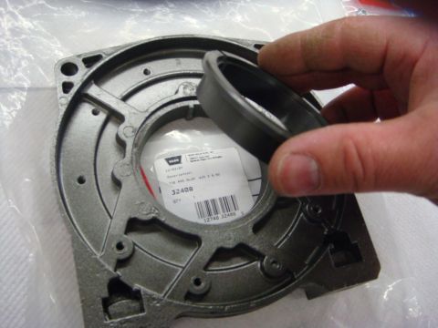 1996 Ford Bronco - Photograph of a Warn winch end housing and seal during a rebuild, not a technical document.