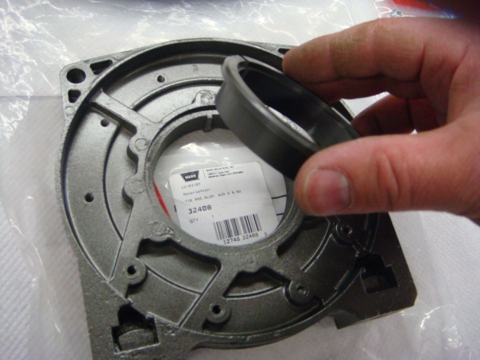 Photo of a Warn winch housing casting with seal and parts label