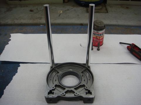 1996 Ford Bronco - Photograph of a partially assembled winch housing with tie rods, not a technical document.