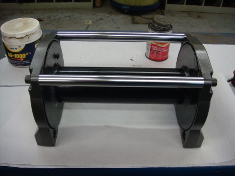1996 Ford Bronco - Workshop photo of a rebuilt winch roller/drum assembly on a bench, not a technical document.
