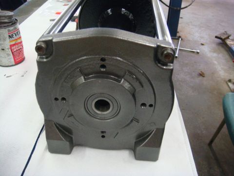 1996 Ford Bronco - Workshop photo of a winch gearbox housing face on a bench, not a technical document.