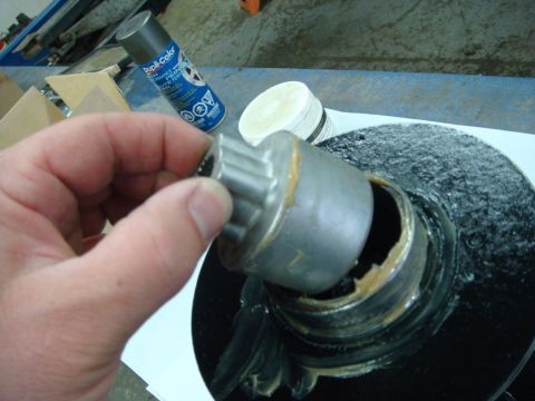 1996 Ford Bronco - Workshop photo of a greased winch sun gear being installed, not a technical document.