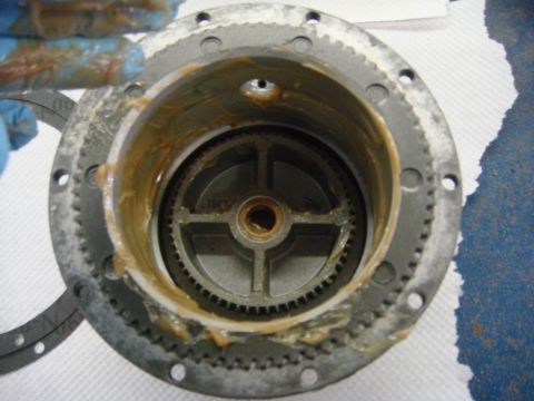 1996 Ford Bronco - Workshop photo of a winch planetary gearset packed with grease, not a technical document.