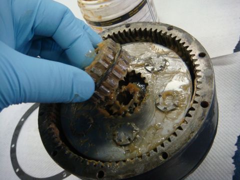 1996 Ford Bronco - Workshop photo of a winch planet gear being installed in the ring gear, not a technical document.
