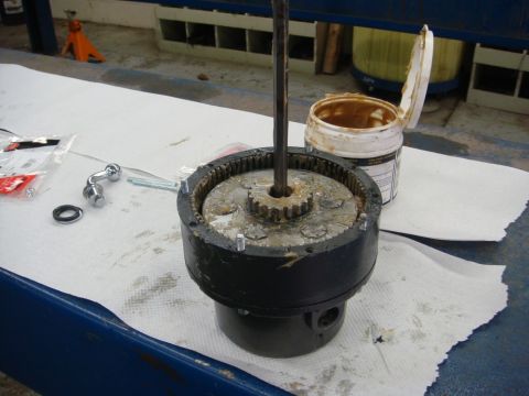 1996 Ford Bronco - Workshop photo of a reassembled winch gearbox with shaft, not a technical document.