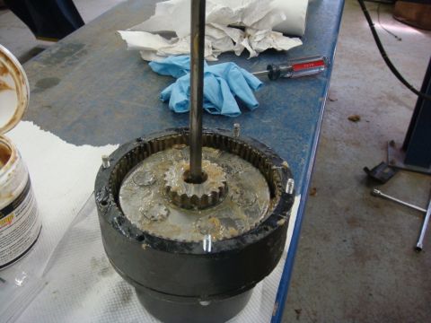 1996 Ford Bronco - Workshop photo of a winch gearbox with sun gear and shaft, not a technical document.