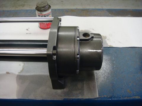1996 Ford Bronco - Workshop photo of an assembled winch housing and rollers, not a technical document.