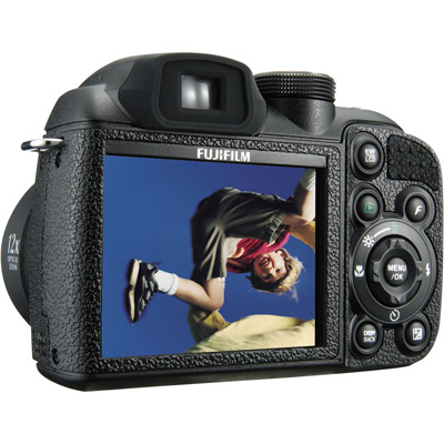 1986 Ford Bronco - A black Fujifilm digital camera is shown from the back, displaying a photo of a person in mid-air.