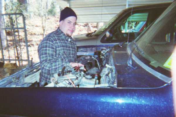 Me painting the engine bay.  One of the few things I was allowed to do on my own.