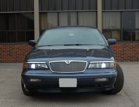 1985 Mercury Grand Marquis - This Mercury Grand Marquis features a distinctive grille and headlights, indicative of a mid-1990s model.