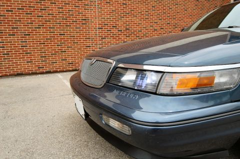 1985 Mercury Grand Marquis - Front end of a Mercury Grand Marquis, showing the grille and headlights.