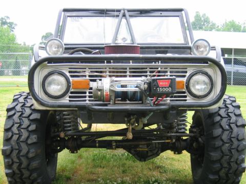 1992 Ford Mustang - This heavily modified 1974 Ford Bronco features a prominent winch and off-road tires, contradicting the claim of a 1992 Ford Mustang.
