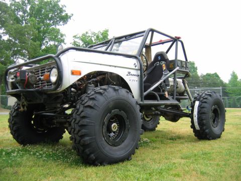 1992 Ford Mustang - This heavily modified 1974 Ford Bronco features a custom roll cage, oversized off-road tires, and a winch on the front bumper.