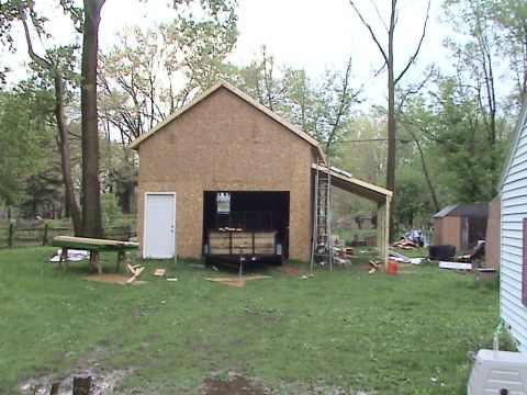 1946 Ford F1 - A garage is being built, with a trailer parked just inside the open doorway.