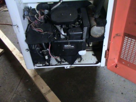 1946 Ford F1 - The engine compartment of a piece of heavy equipment is open, revealing the engine and associated components.