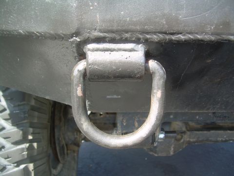 1993 Toyota 4Runner - Close-up of a custom-welded tow hook attached to a vehicle's front bumper.