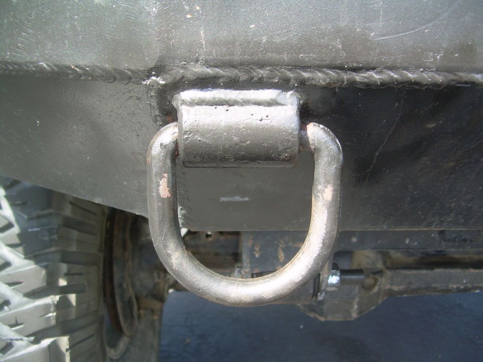 Custom front bumper tow hook on a vehicle