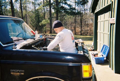 1988 Ford Bronco - That's me working on getting the intake mounted. I finally got an important task.