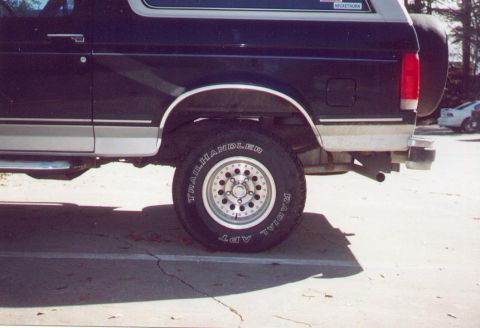 1990 Ford Bronco - Side profile of a 1990 Ford Bronco, its two-tone paint scheme and Trail Handler tires.