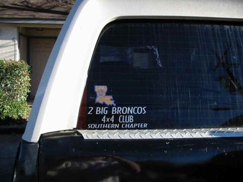 1990 Ford Bronco - A sticker on the rear window advertises the '2 BIG BRONCOS 4x4 CLUB SOUTHERN CHAPTER'.
