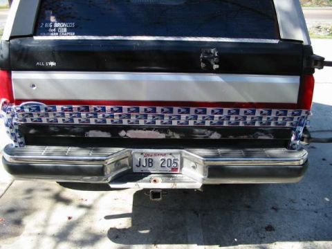 1990 Ford Bronco - Rear view of a 1990 Ford Bronco, a license plate and decorative USPS tape.
