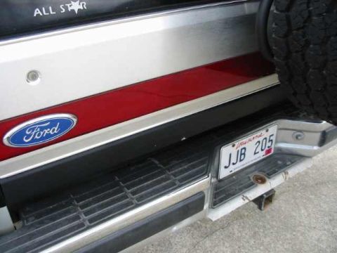 1990 Ford Bronco - The rear of a Ford vehicle shows the iconic Ford oval badge and a California license plate.