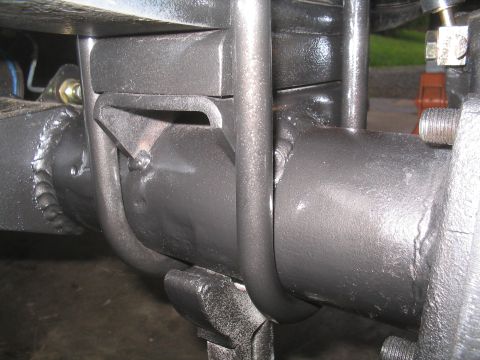 1979 Ford Bronco - Rear axle U-bolt and spring plate assembly, showing welded construction.