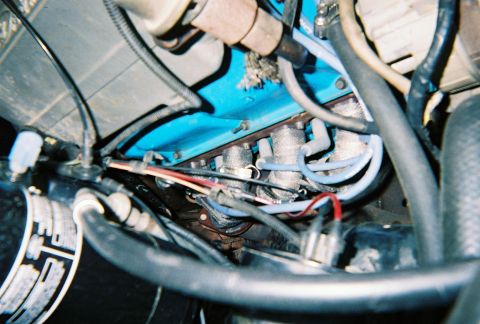 1988 Ford Bronco - Passanger side header wrap. The boots on my old wires were burnt so I replaced them with 9 MM wires and wrapped the headers to help preserv…