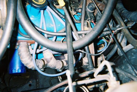 1988 Ford Bronco - Driver's side, I know the hose clamps are exactly bling bling, but they work. The wrap is suppose to increase horsepower, now all I need is…
