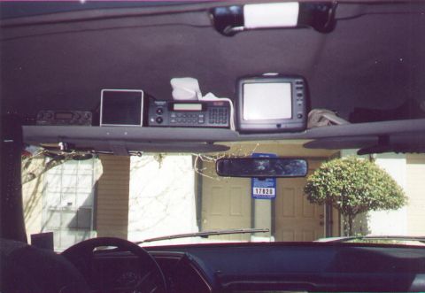 1990 Ford Bronco - This is an interior shot of a vehicle, showing multiple screens mounted above the dashboard.