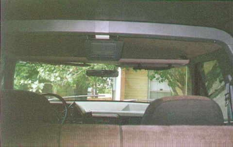 1990 Ford Bronco - View from the back seat of a car, looking towards the dashboard and windshield.