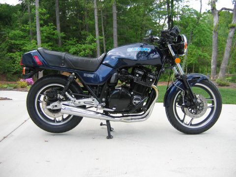 1985 Ford LTD Crown Victoria - Photograph of a blue Suzuki motorcycle outdoors, not a technical document.