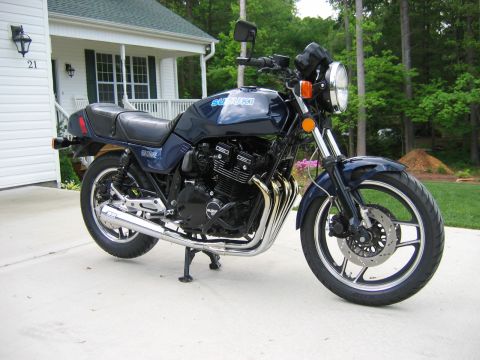1985 Ford LTD Crown Victoria - Photograph of a blue Suzuki motorcycle outdoors, not a technical document.