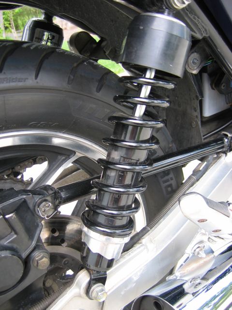 1985 Ford LTD Crown Victoria - Photograph of a motorcycle rear shock absorber, not a technical document.