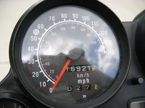 1985 Ford LTD Crown Victoria - Photograph of a motorcycle speedometer gauge, not a technical document.