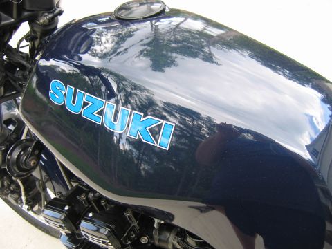 1985 Ford LTD Crown Victoria - Photograph of a Suzuki motorcycle fuel tank, not a technical document.