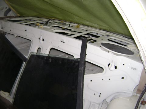 2001 Ford Crown Victoria - Interior view of a car's structural components and window frame, suggesting ongoing work.