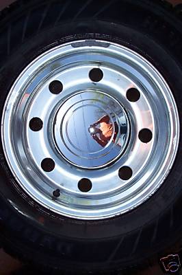 2006 Ford E250 - Close-up of a chrome wheel and tire assembly, likely for a commercial vehicle.