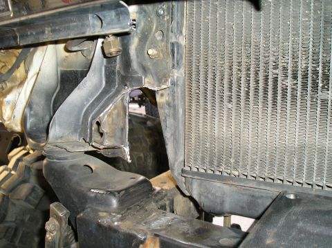 1986 Toyota Hilux - Close-up view of a vehicle's radiator and its custom-fitted mounting hardware.