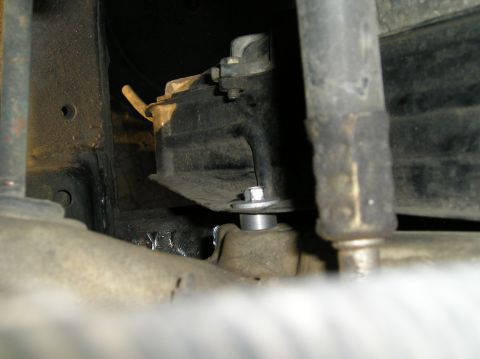 1986 Toyota Hilux - A close-up view of a vehicle's undercarriage component, with the Supermotors.net logo visible at the bottom right.