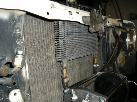 1986 Toyota Hilux - Close-up view of the radiator and an auxiliary oil cooler mounted in front of it.