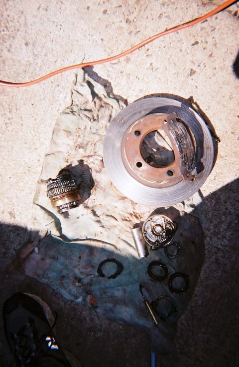 1988 Ford Bronco - A week later Shane and I are repacking bearings, putting on Warn manual hubs and replacing this metal to metal rotor and what is left of a…