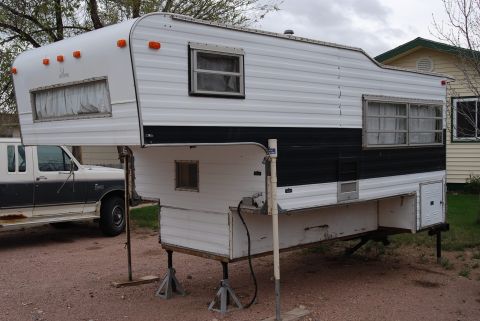 1987 Ford F-250 - This 1987 Ford F-250 is shown with a camper installed, obscuring much of the truck's details.